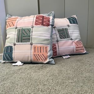 Cotton and poly set of throw pillows
